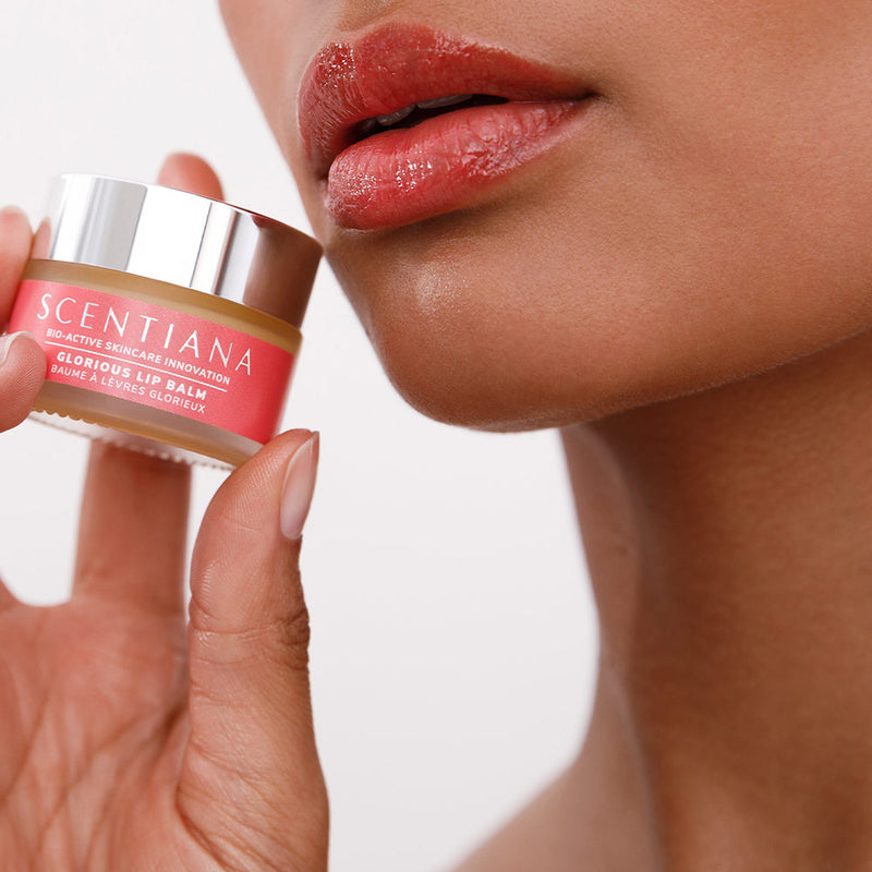 Woman With Glorious Shining Lips Holding Lip Blush