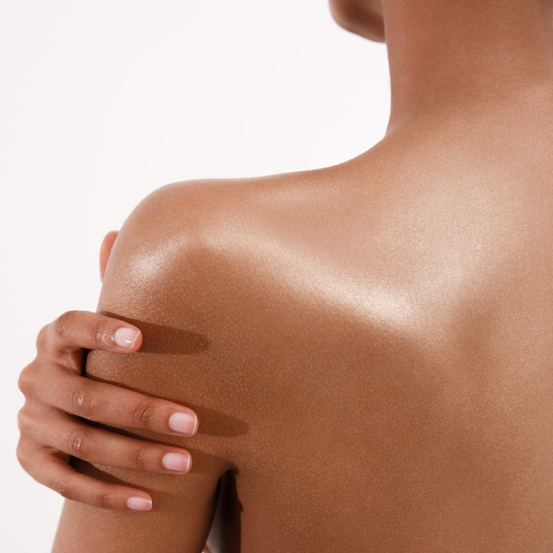 Woman's Back With Shimmering Skin