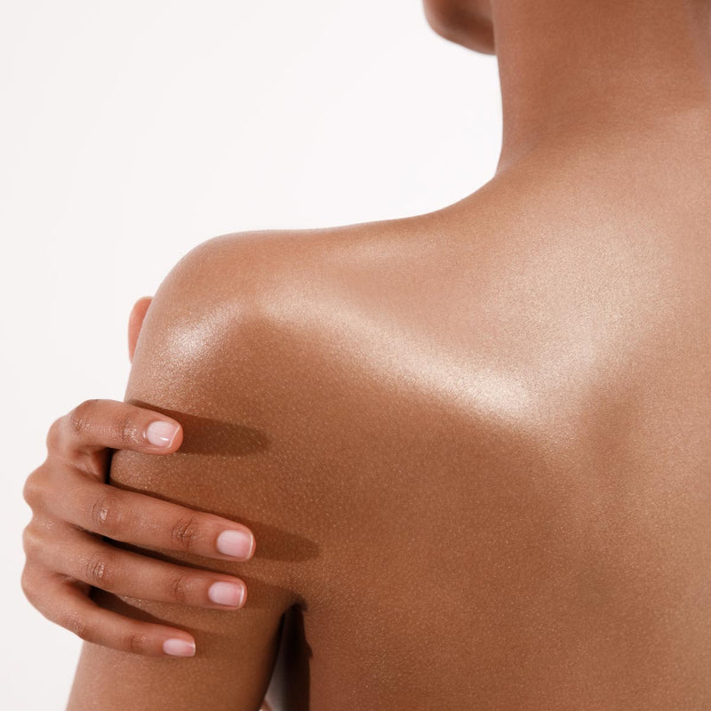Woman's Back With Shimmering Skin