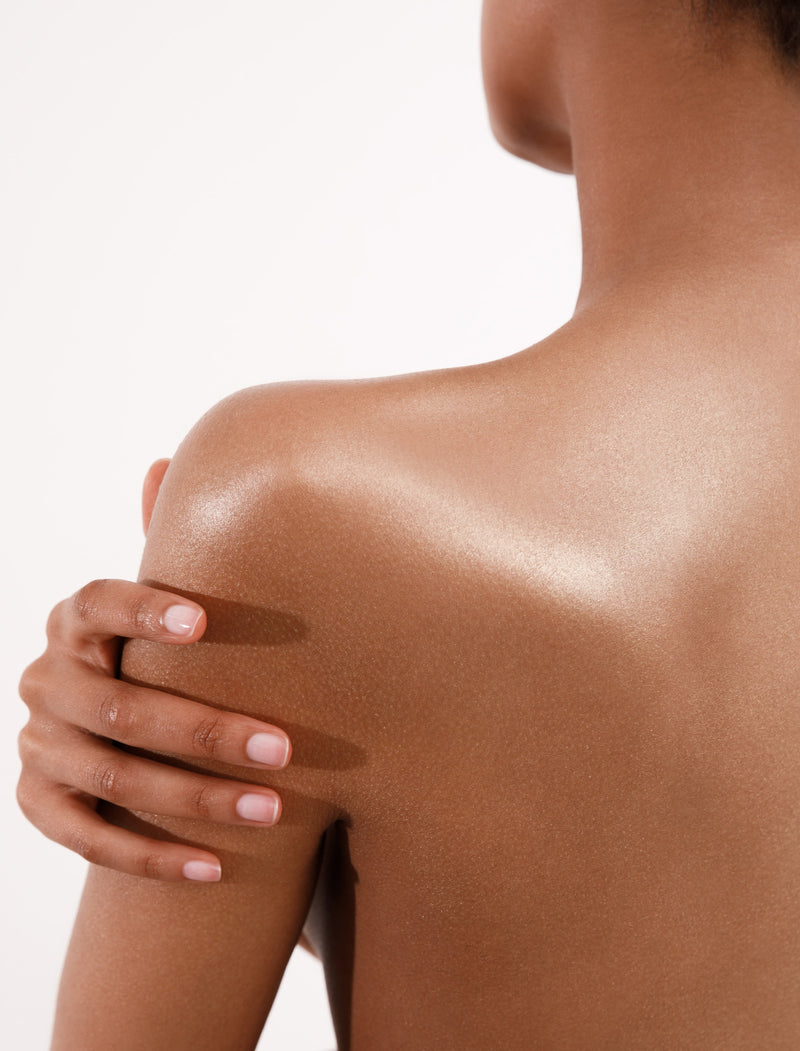 Woman's Back With Shimmering Skin