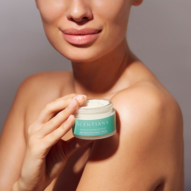 Woman Holding Body Cream Product In Hands